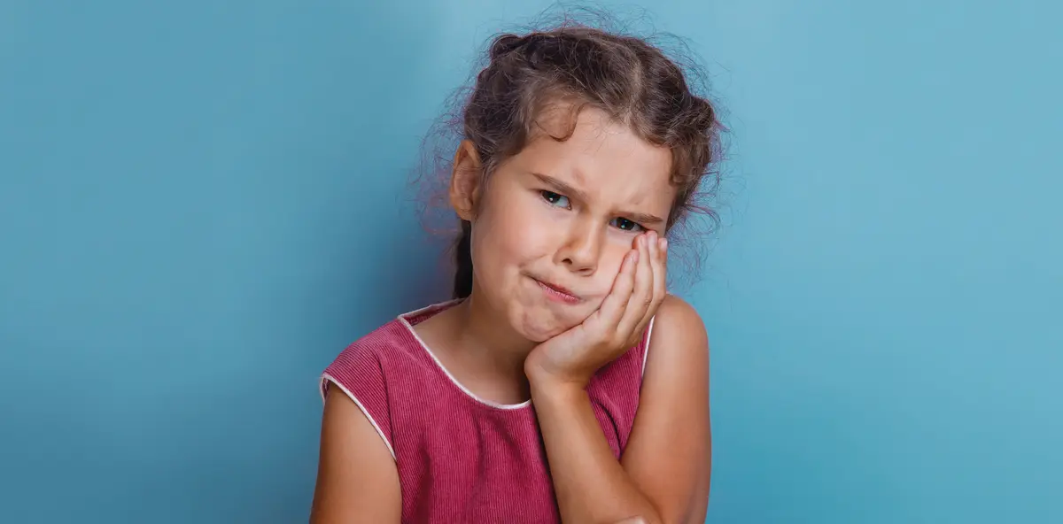 little girl with toothache