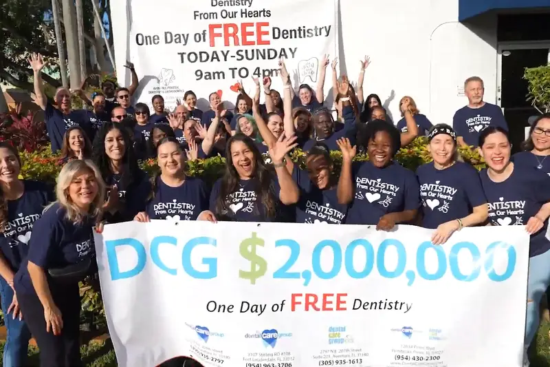 The team with the One Day of Free Dentistry banner in 2025