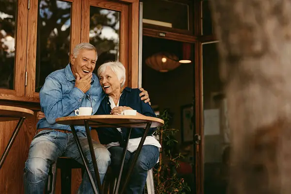 elderly couple enjoying coffee