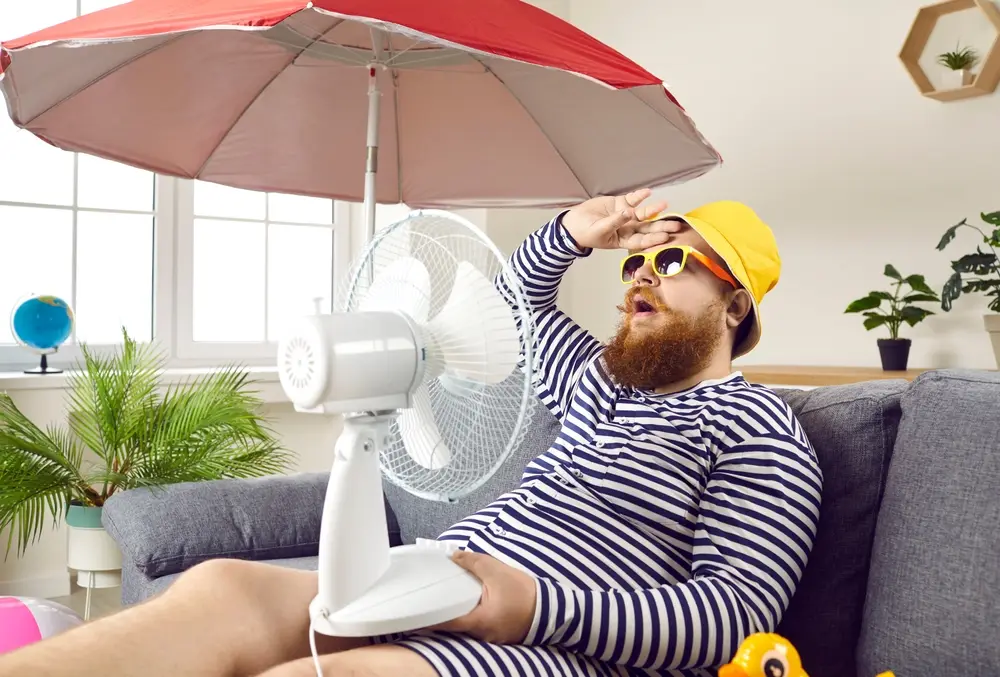 man suffering in hot florida weather