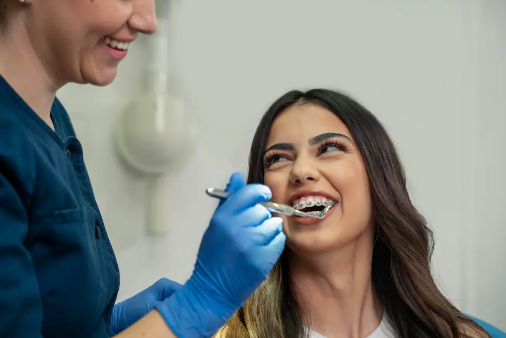 woman with braces at dental checkup