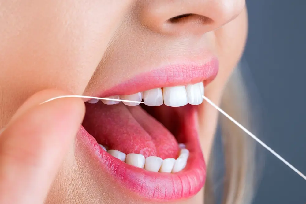 flossing between the teeth